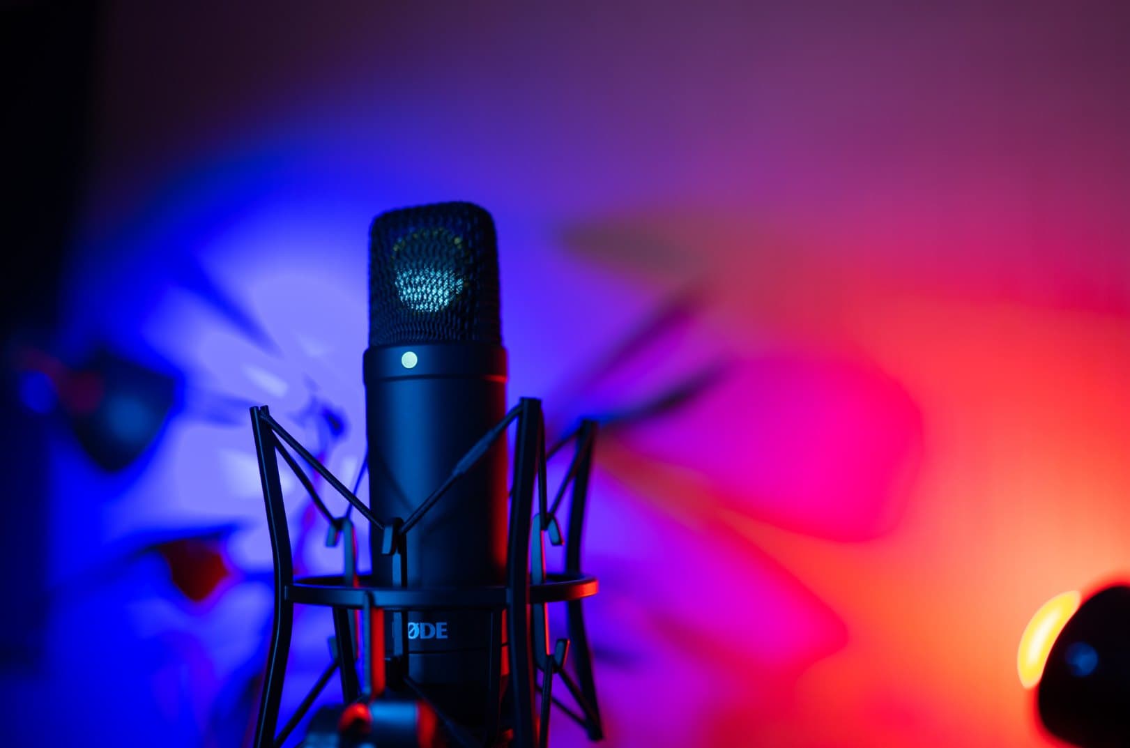 Studio condenser microphone in coloured light